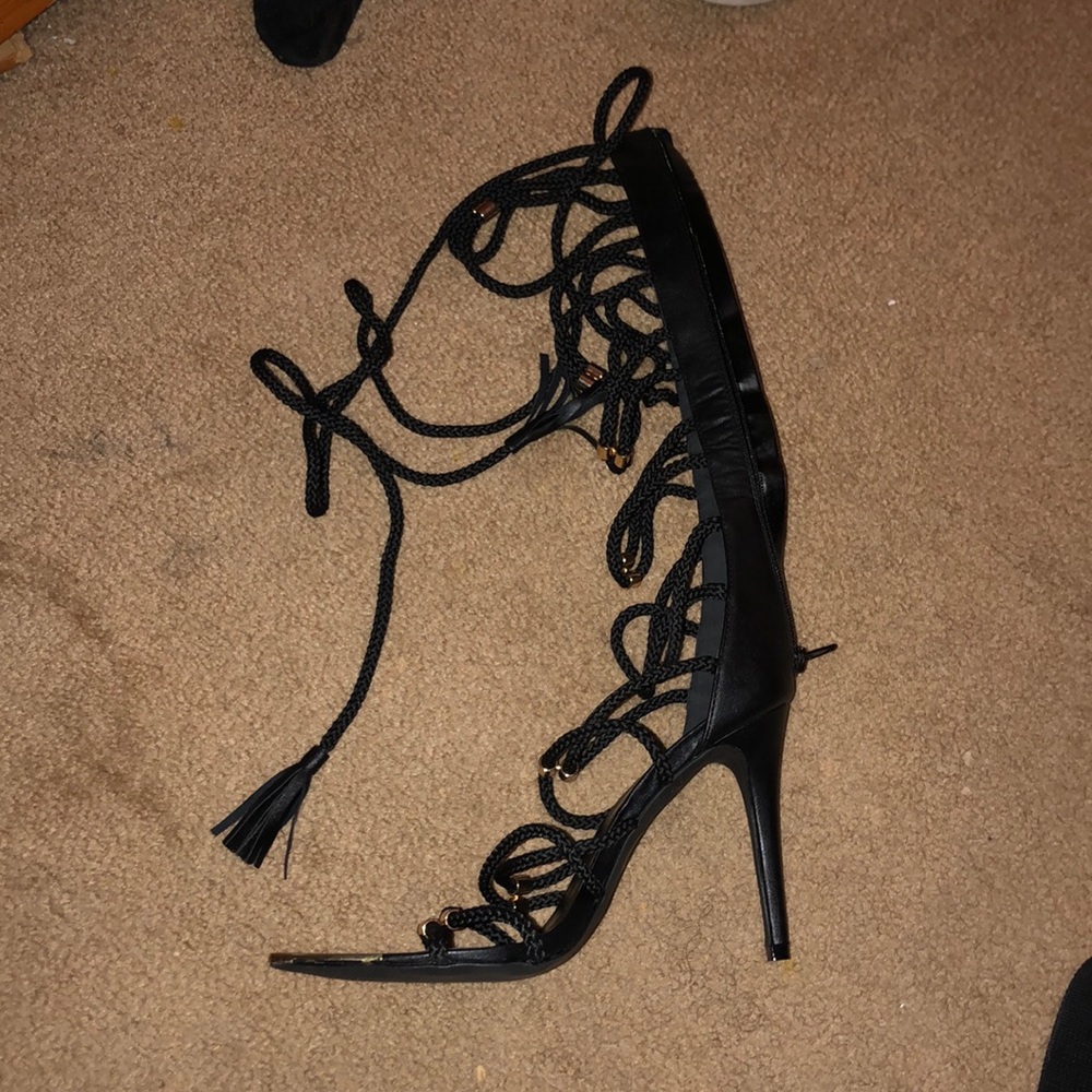 Thigh high strap heels